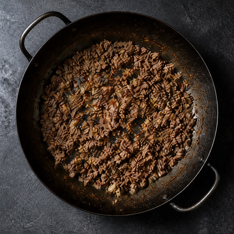 Step 1: Brown the beef with garlic and chili, set aside.