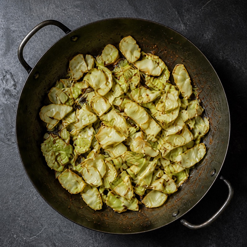 Step 2: Fry the cabbage hot until edges char, 5 minutes.