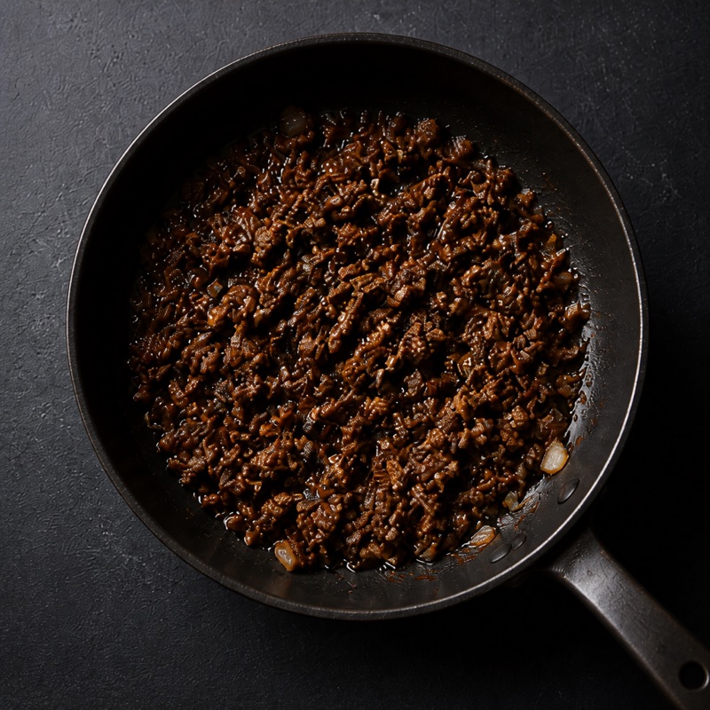 Step 2: Brown the beef with garlic, then stir in soy sauce and honey.