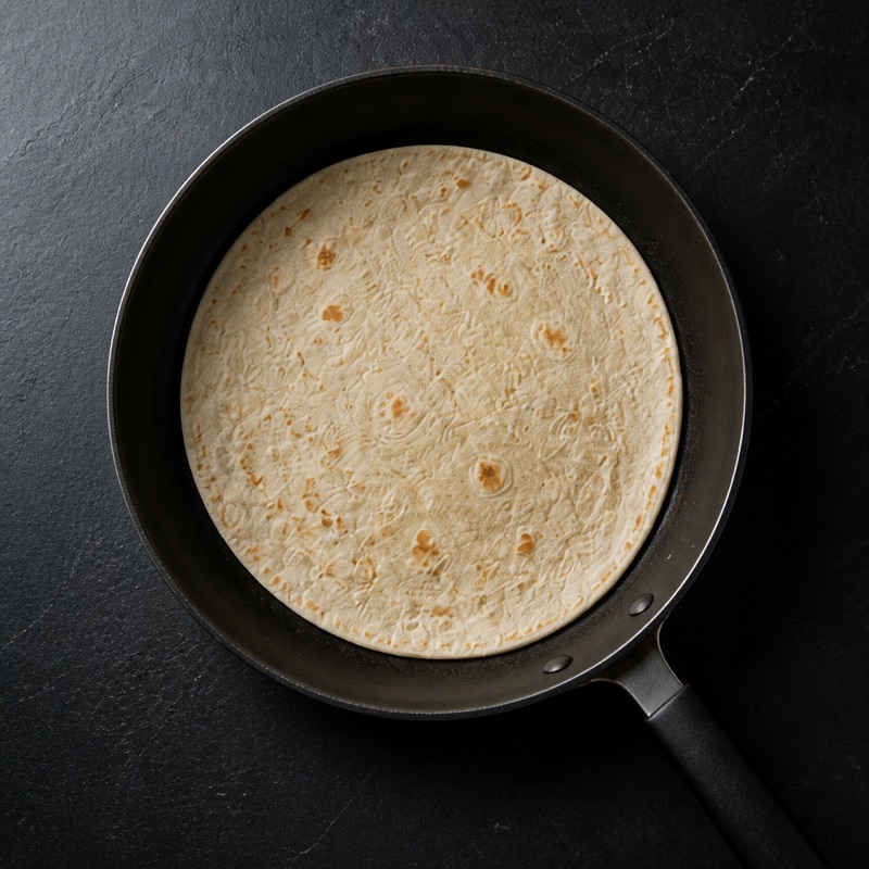 Step 2: Warm the tortilla so it folds without cracking.