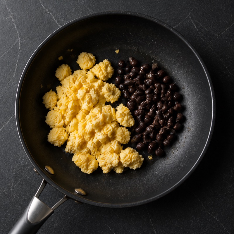 Step 1: Scramble the eggs, warm the beans in the same pan.