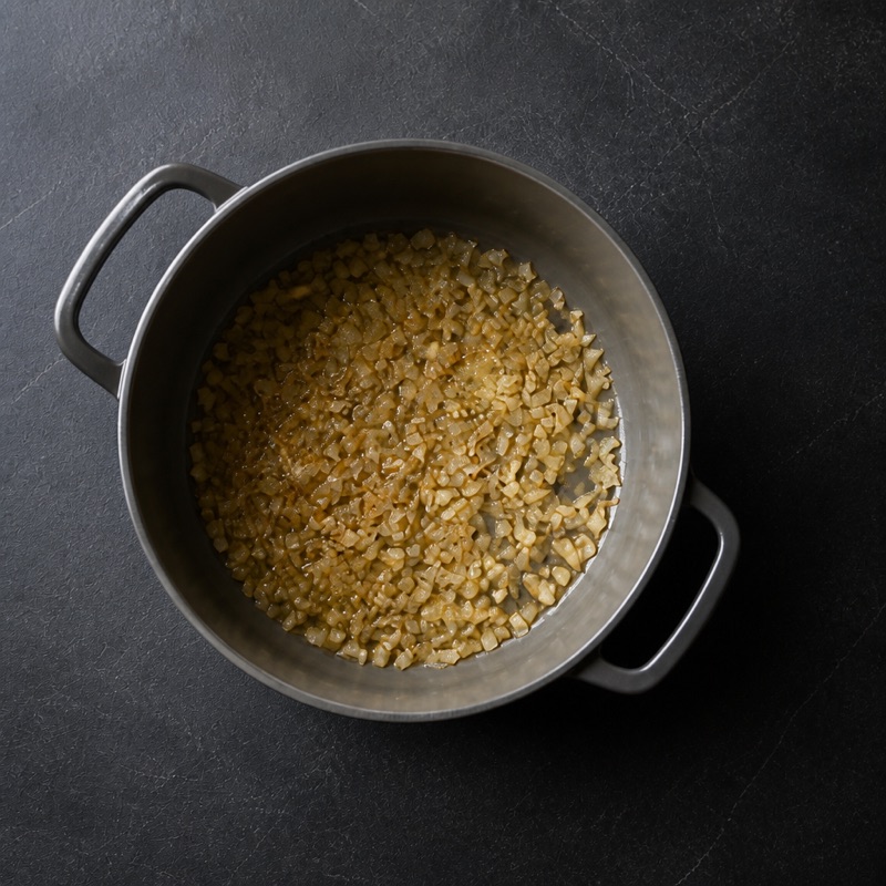 Step 1: Fry onions and garlic in oil until golden.