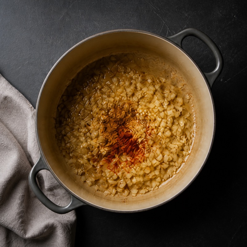 Step 1: Fry onion and garlic, add the spices.