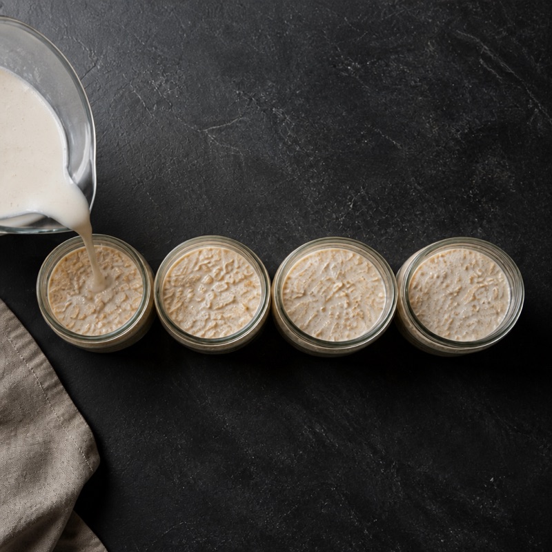 Step 2: Split oats into 5 jars, pour the liquid over.
