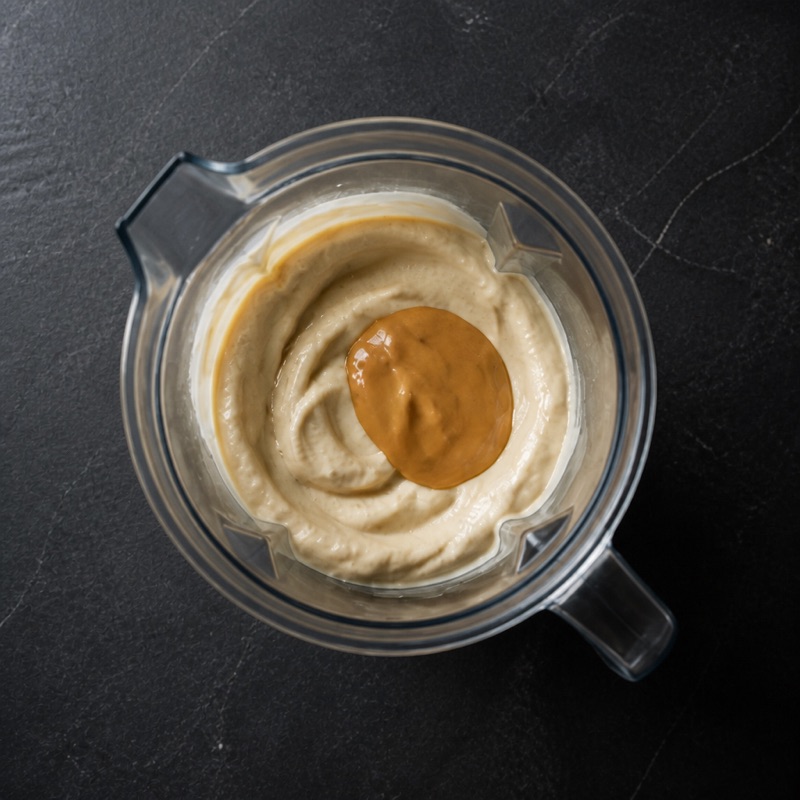 Step 2: Add peanut butter, pulse twice.