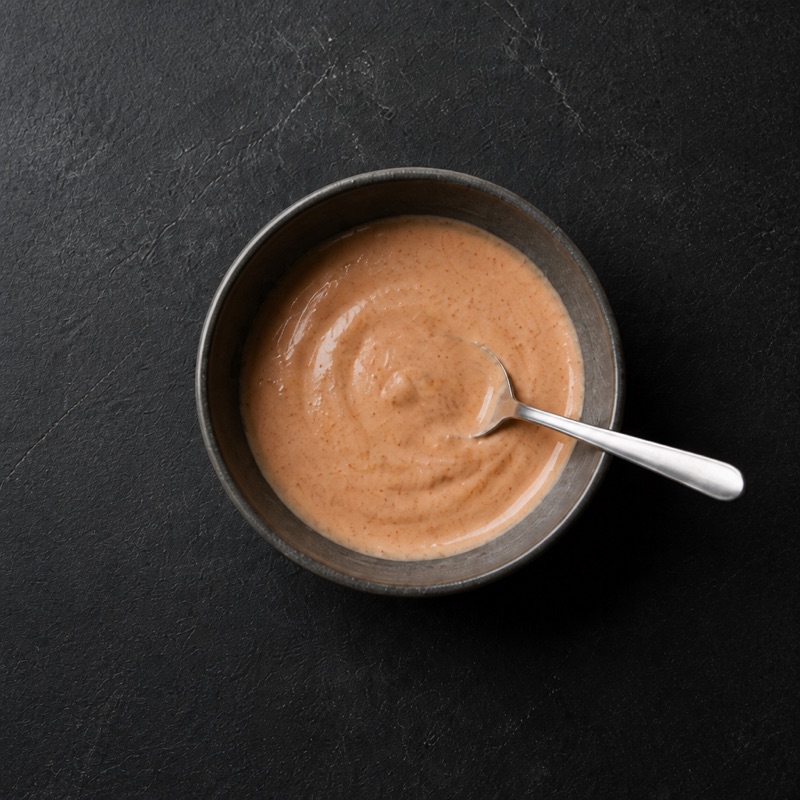 Step 2: Mix yogurt and hot sauce into a pink crema.